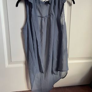 H&M blue followed sleeveless almost see thru shirt.